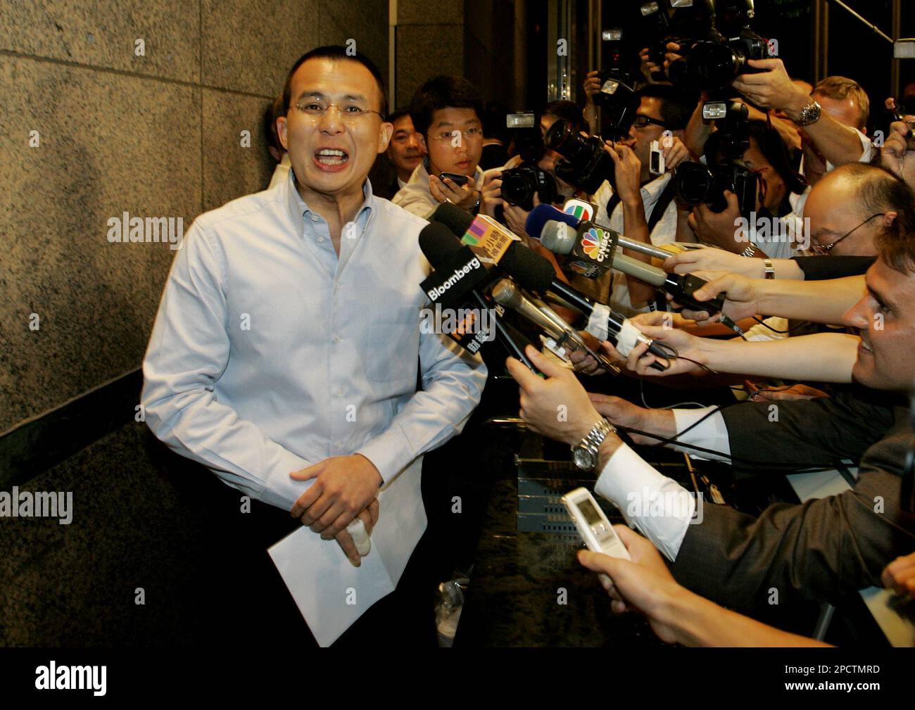 PCCW Ltd. chairman Richard Li speaks to media after a meeting in Hong Kong  Monday, July 10, 2006. Richard Li announces sale of 23 percent stake in Hong  Kong phone operator PCCW