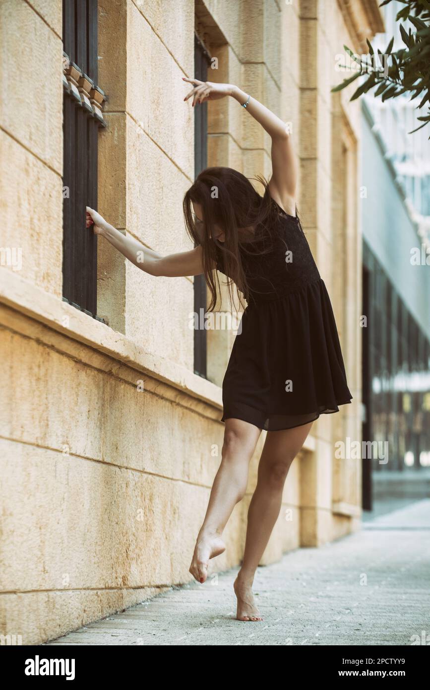 Barefooted ballet dancer dancing in the street Stock Photo