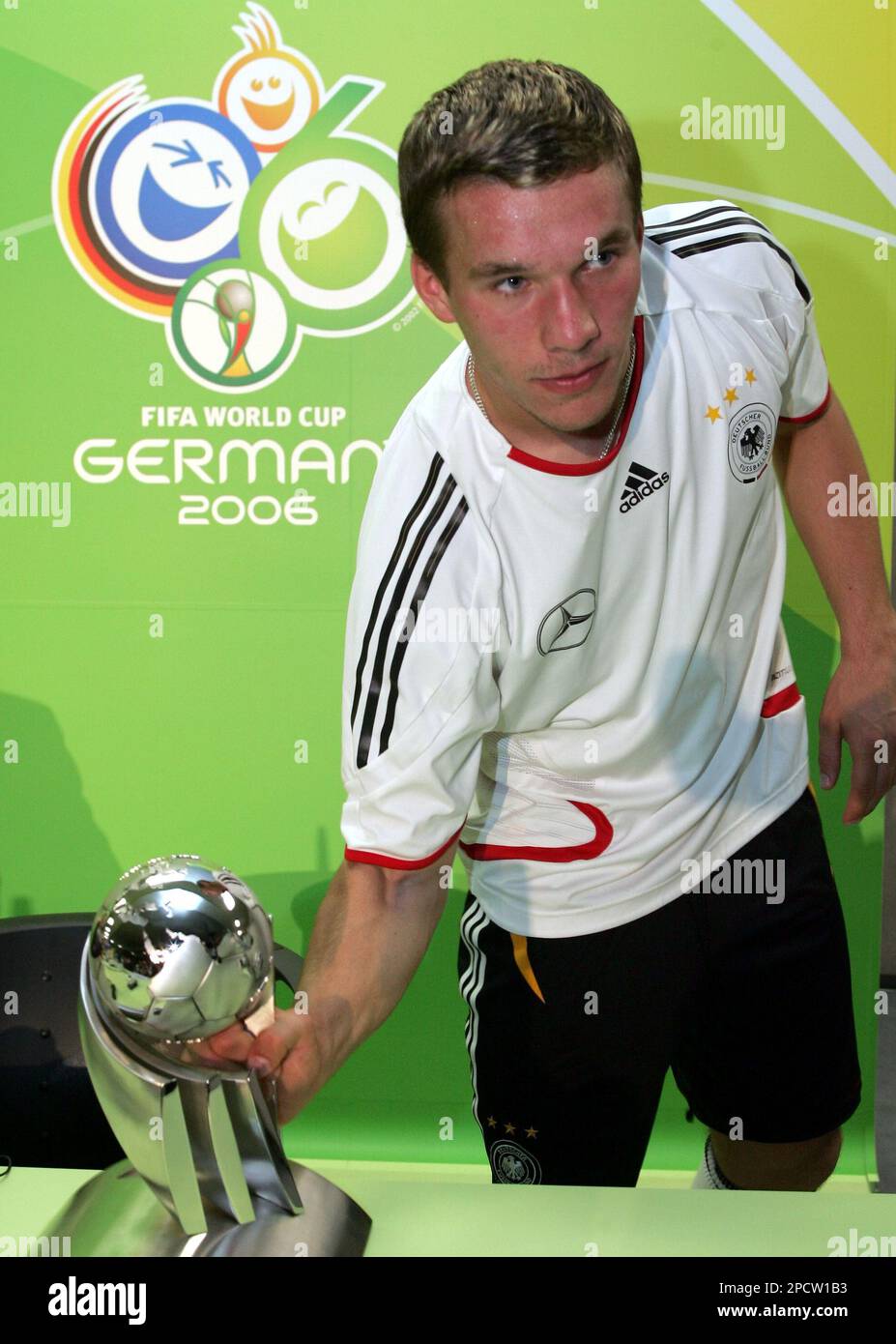 German national soccer team player Lukas Podolski holds the