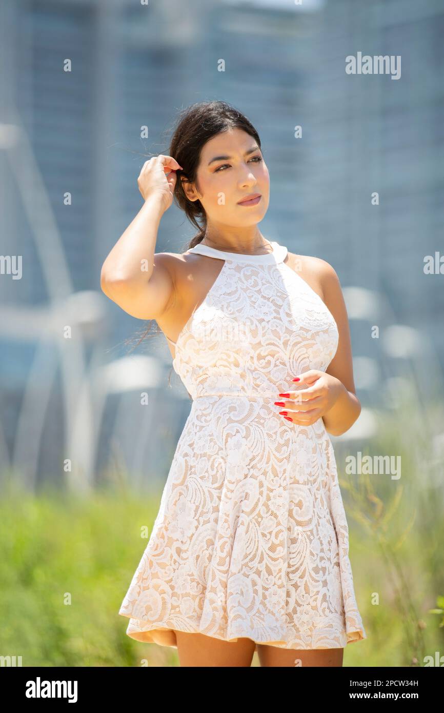 Beautiful latina woman in white hi-res stock photography and images - Alamy