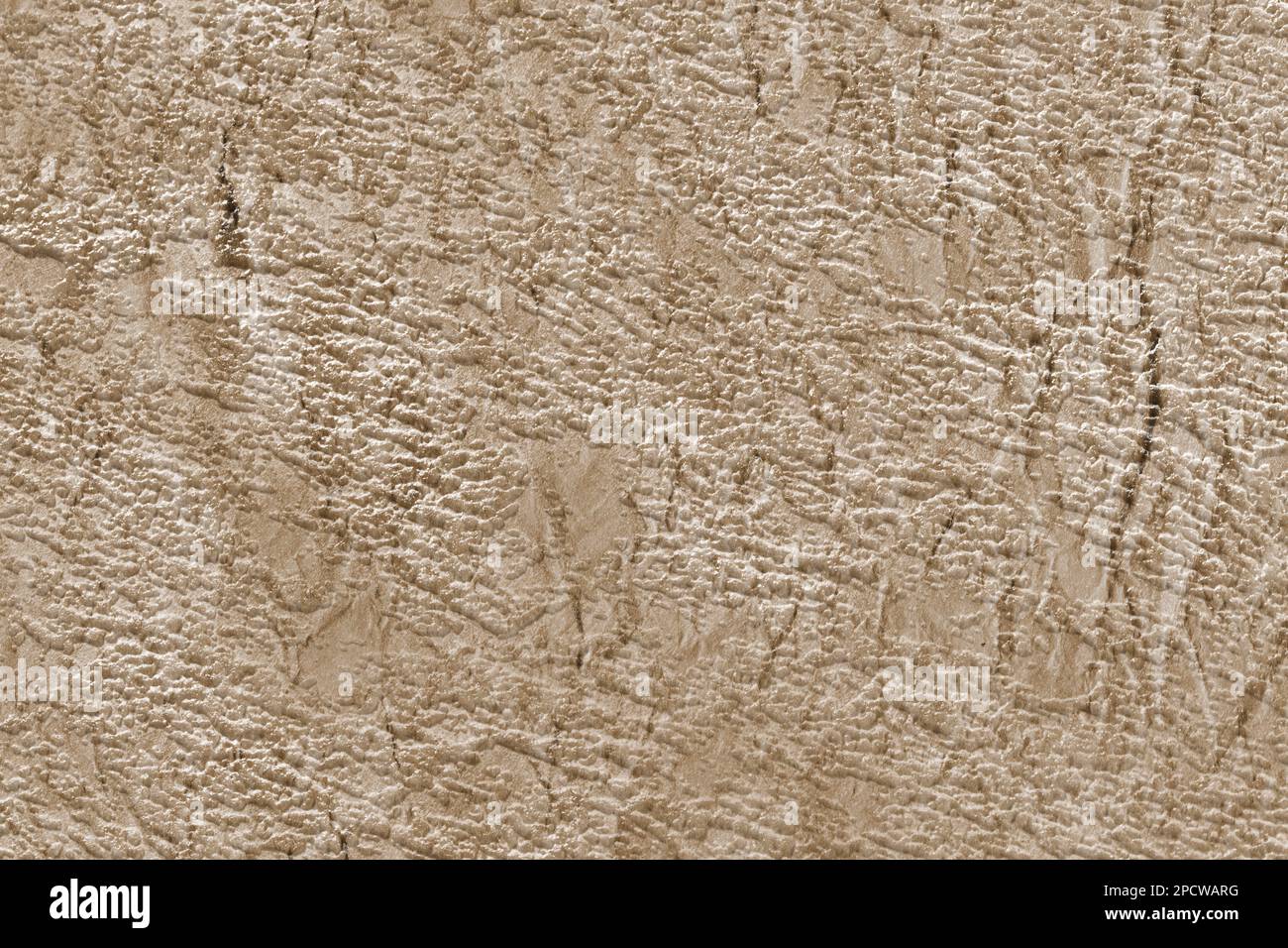 Paper textured background in beige color with scuffs and scratches