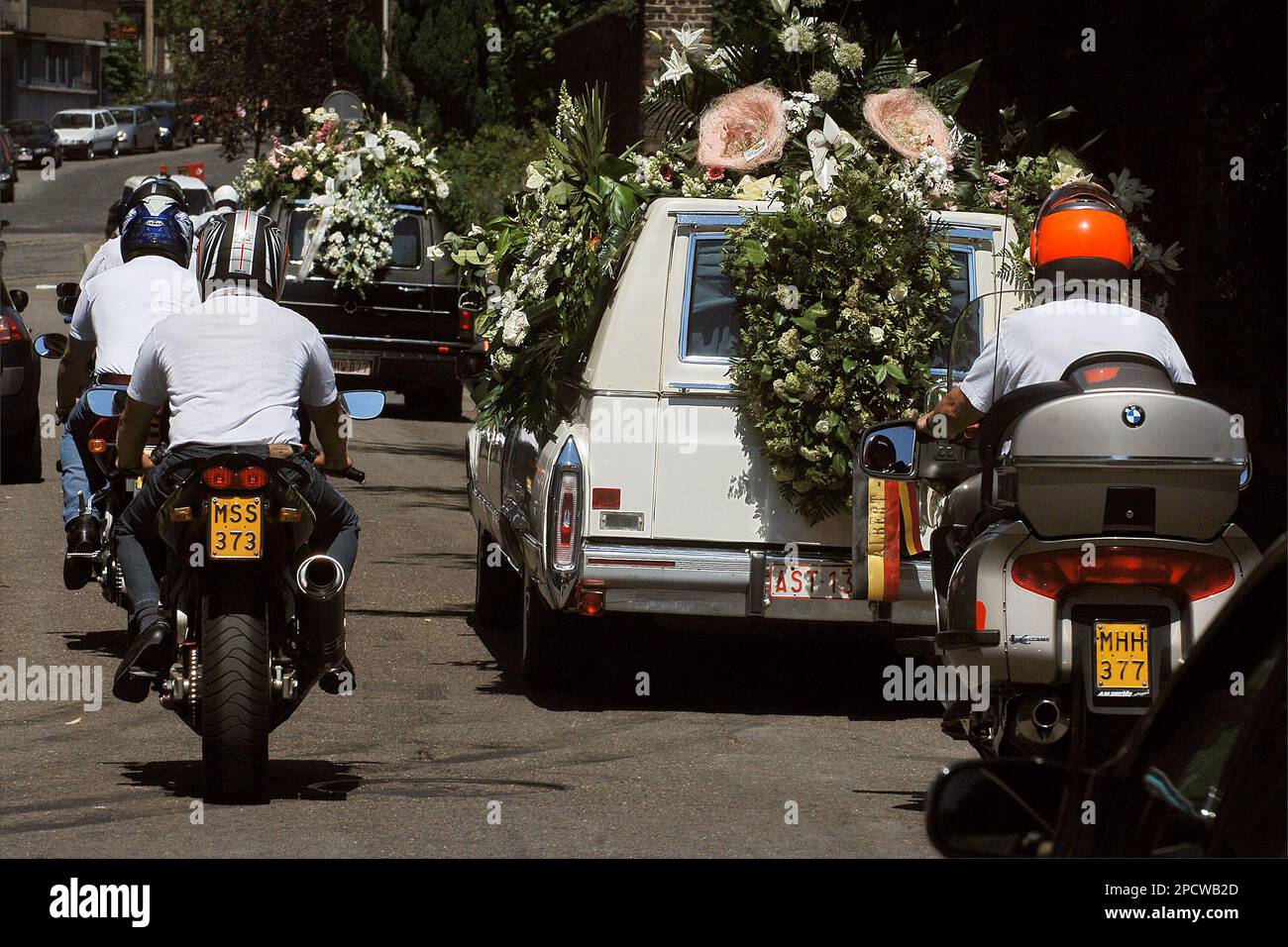 Bikers escort the hearse with the coffin of slain girl Stacy Lemmens (7)  after the funeral service at the St. Foy church in Liege, Belgium, Monday  July 3, 2006. The two Belgian