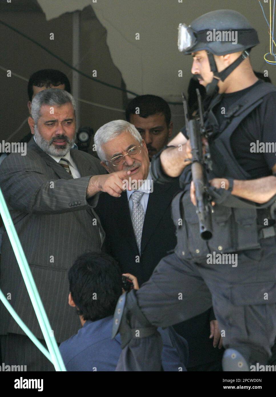 Palestinian Authority President Mahmoud Abbas, center, and Palestinian ...