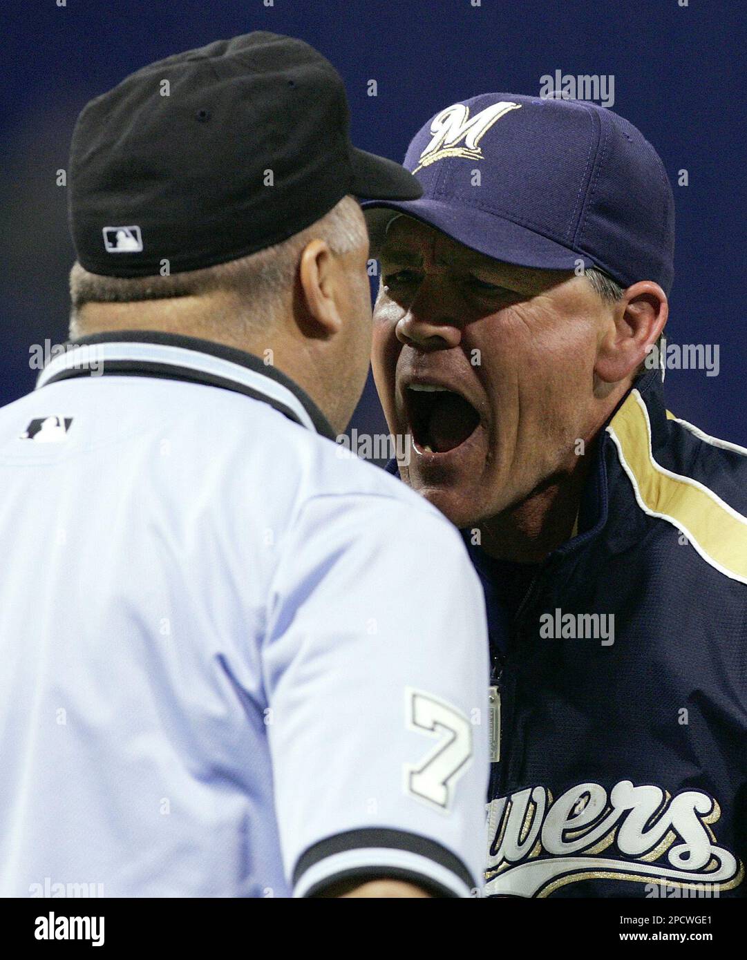 Milwaukee Brewers manager Ned Yost, right, argues with first base ...