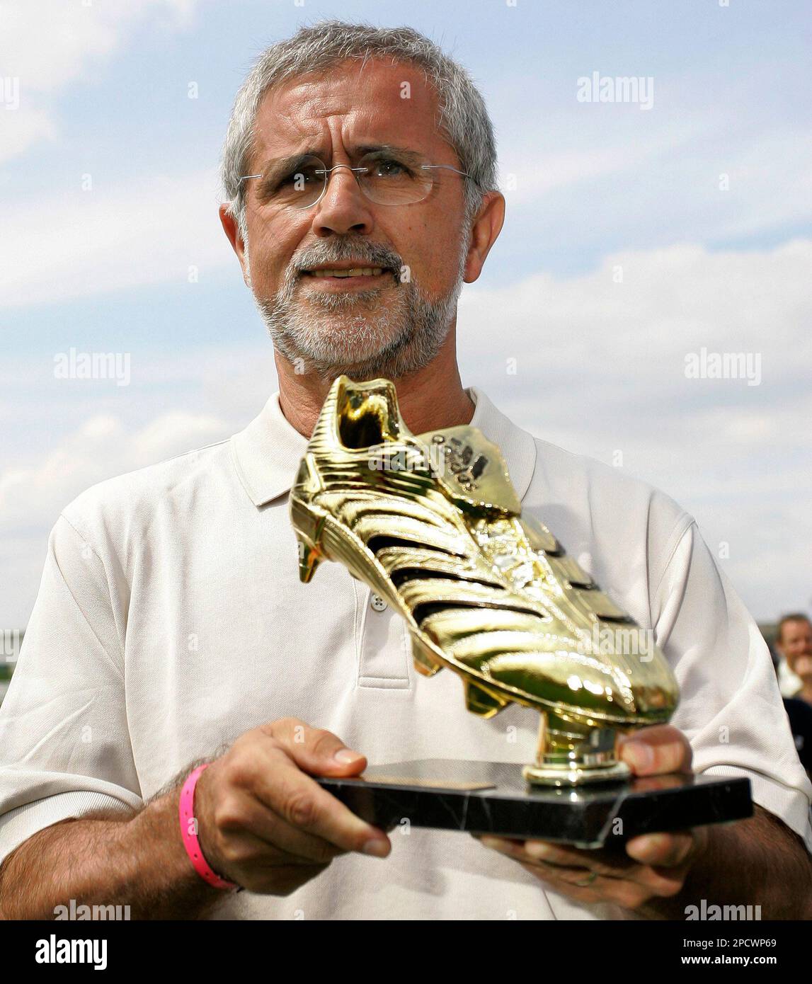 Former German soccer player Gerd Mueller presents the Golden Boot Trophy to  the media at the "adidas World of Football" in Berlin, Thursday, June 29,  2006. The adidas Golden boot is the