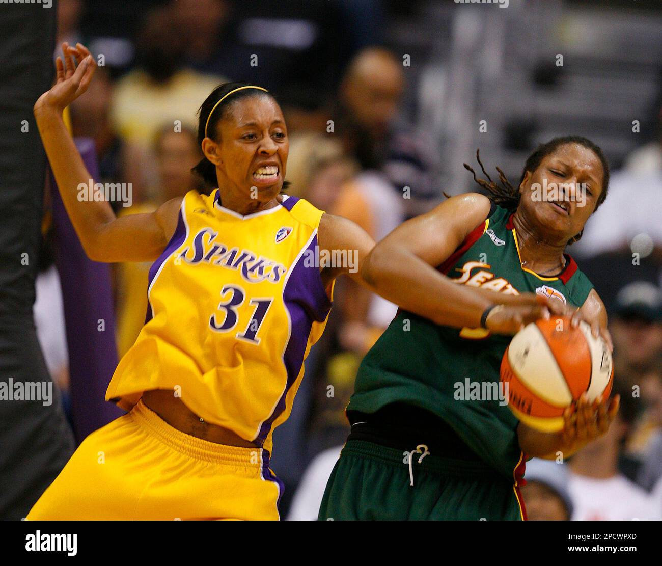 Seattle Storm's Tiffani Johnson, right, works for a rebound against Los ...