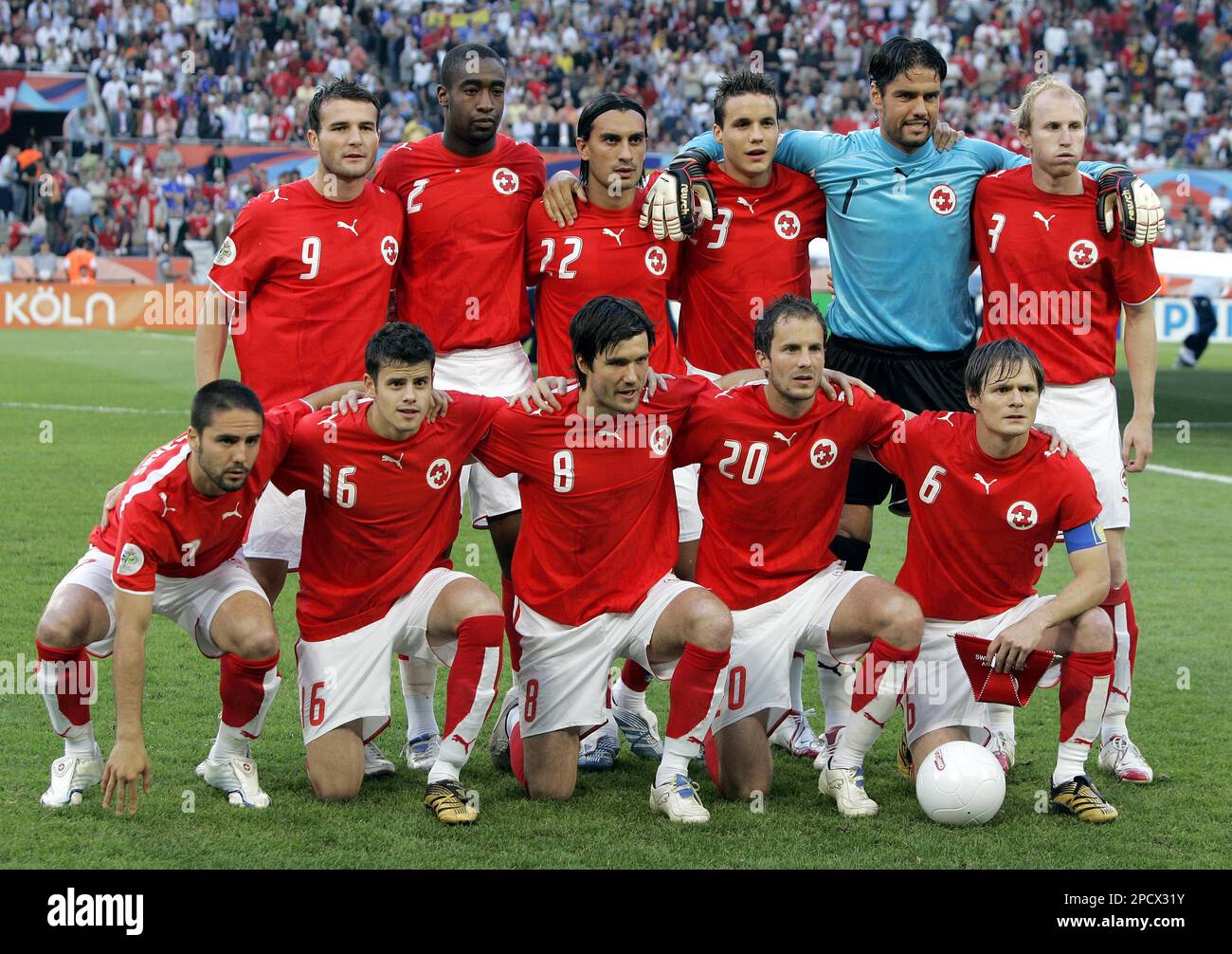 The Swiss national soccer team pose for a team group photo before the start of the World Cup Round of 16 soccer match between Switzerland and Ukraine in the World Cup stadium