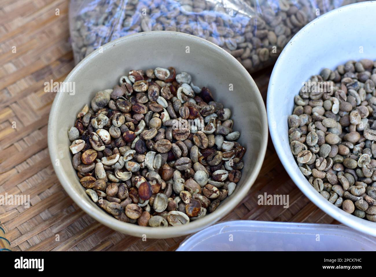 Low quality raw coffee beans. Coffee bean with defect, low grade Stock