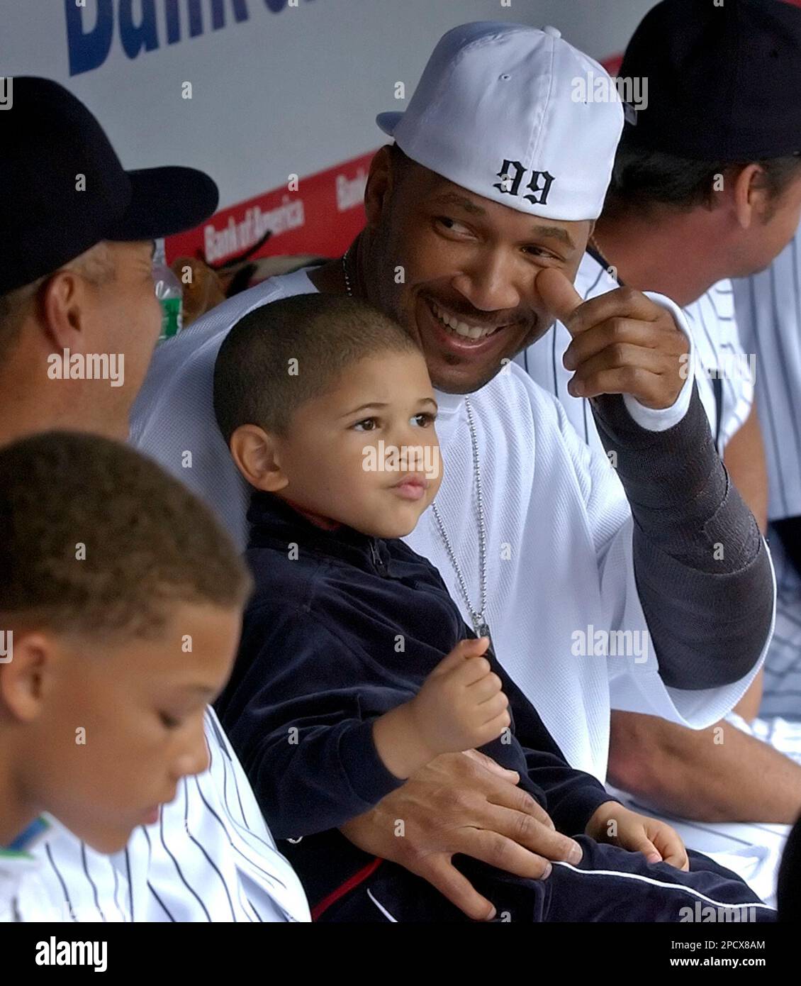 New York Yankees' Gary Sheffield, right, holds his son Jaden Amir