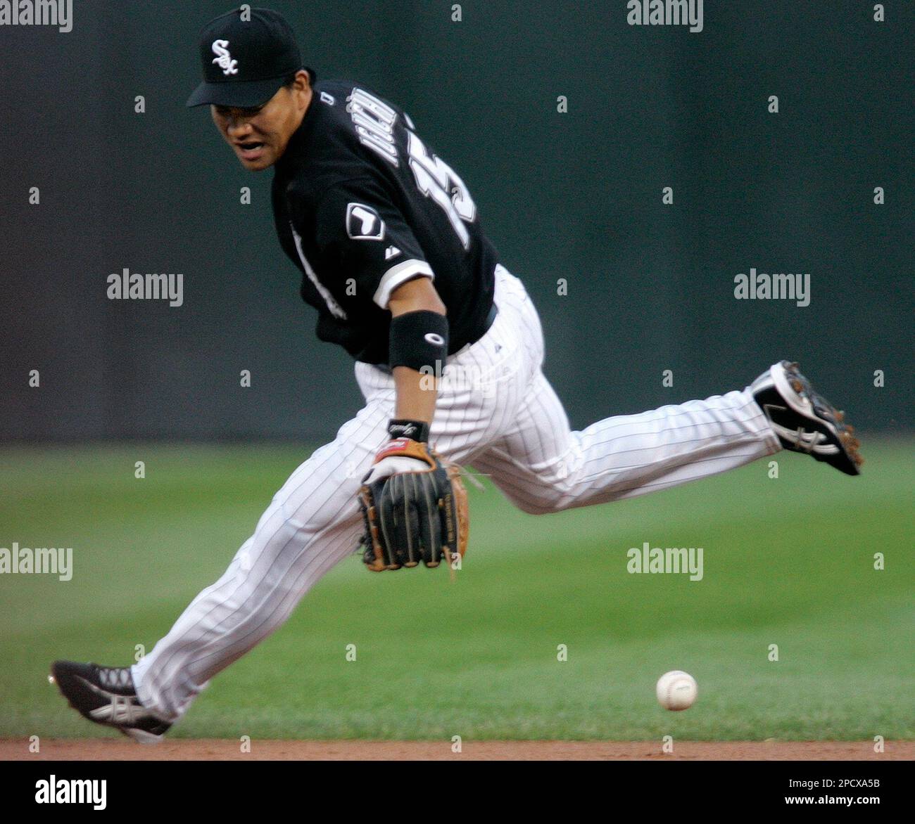Chicago White Sox second baseman Tadahito Iguchi, of Japan cannot get to  Houston Astros' Lance Berkman's infield single during the first inning of a  baseball game in Chicago, Friday, June 23, 2006.