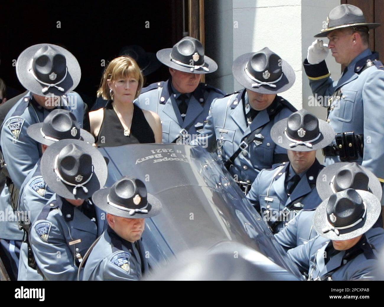 Massachusetts State Trooper Paul Barry's wife, Maryellen, center
