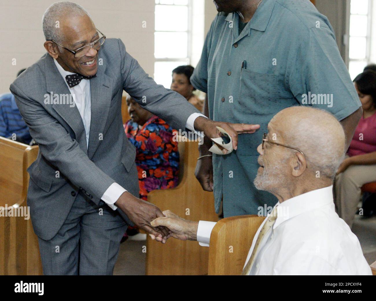 Veteran civil rights worker Hollis Watkins, left, greets Rev. Clint ...