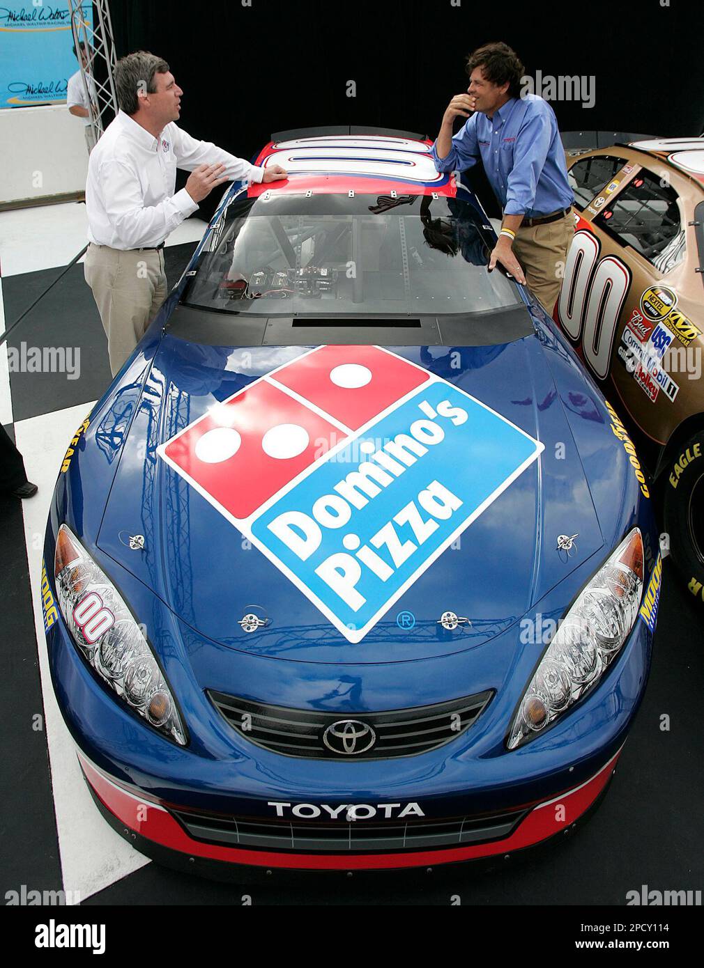 Domino's Pizza Chairman and Chief Executive Officer David A. Brandon, left,  talks with NASCAR team owner Michael Waltrip after announcing Dominos and  Burger King sponsorship of the Toyota 00 car for 2007