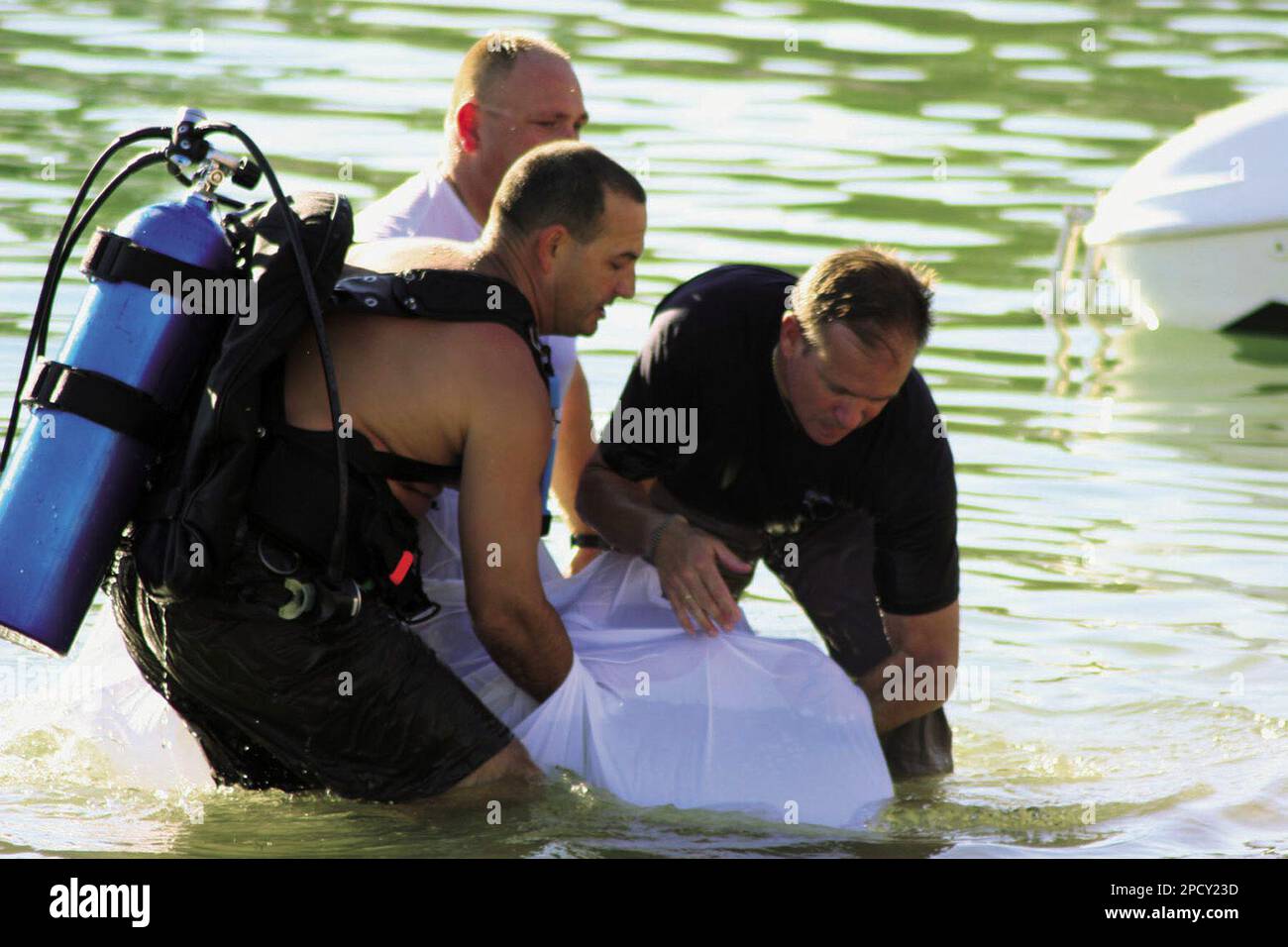 Police recover the body of Austin Tyler Patin, 10, of Mission Hills,  Calif., in the Bridgewater Channel on Saturday, June 17, 2006, in Lake  Havasu City, Ariz. The boy was reported missing