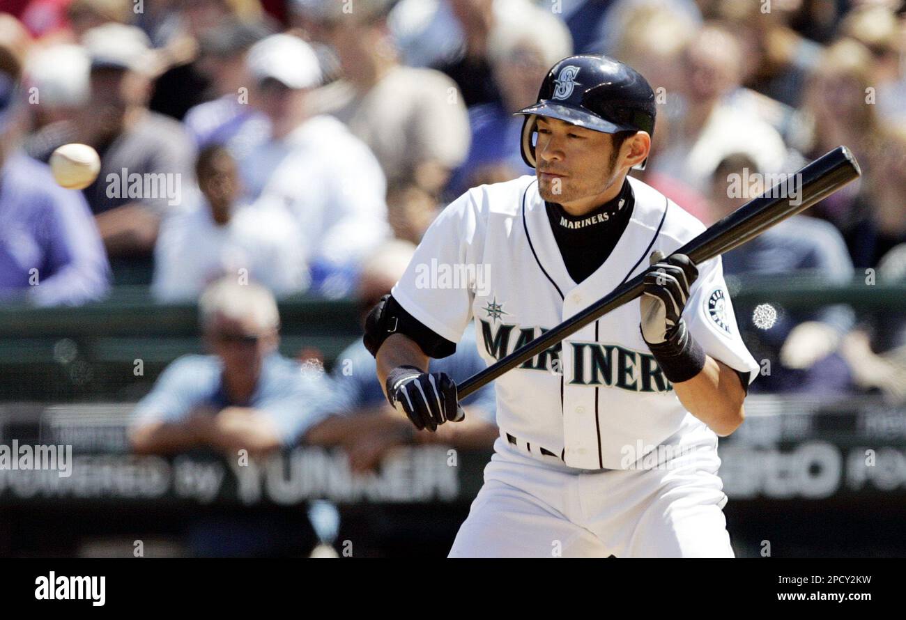 Seattle Mariners' Ichiro Suzuki lets a ball go by after getting ready to  bunt against the San Francisco Giants in the fourth inning in a baseball  game, Saturday, June 17, 2006, in