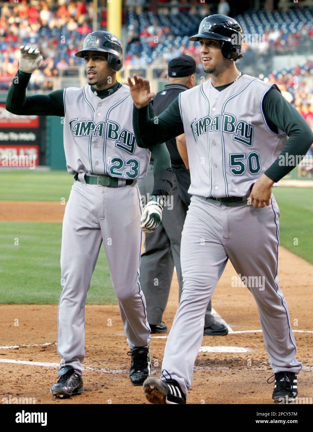 Tampa Bay Devil Rays' Julio Lugo, left, and James Shields walk to the dugout after Lugo hit a home run off Philadelphia Phillies' Cole Hamels with Shields on base in the third inning of a baseball game Friday, June 16, 2006, in Philadelphia. (AP Photo/Rusty Kennedy) Stock Photo