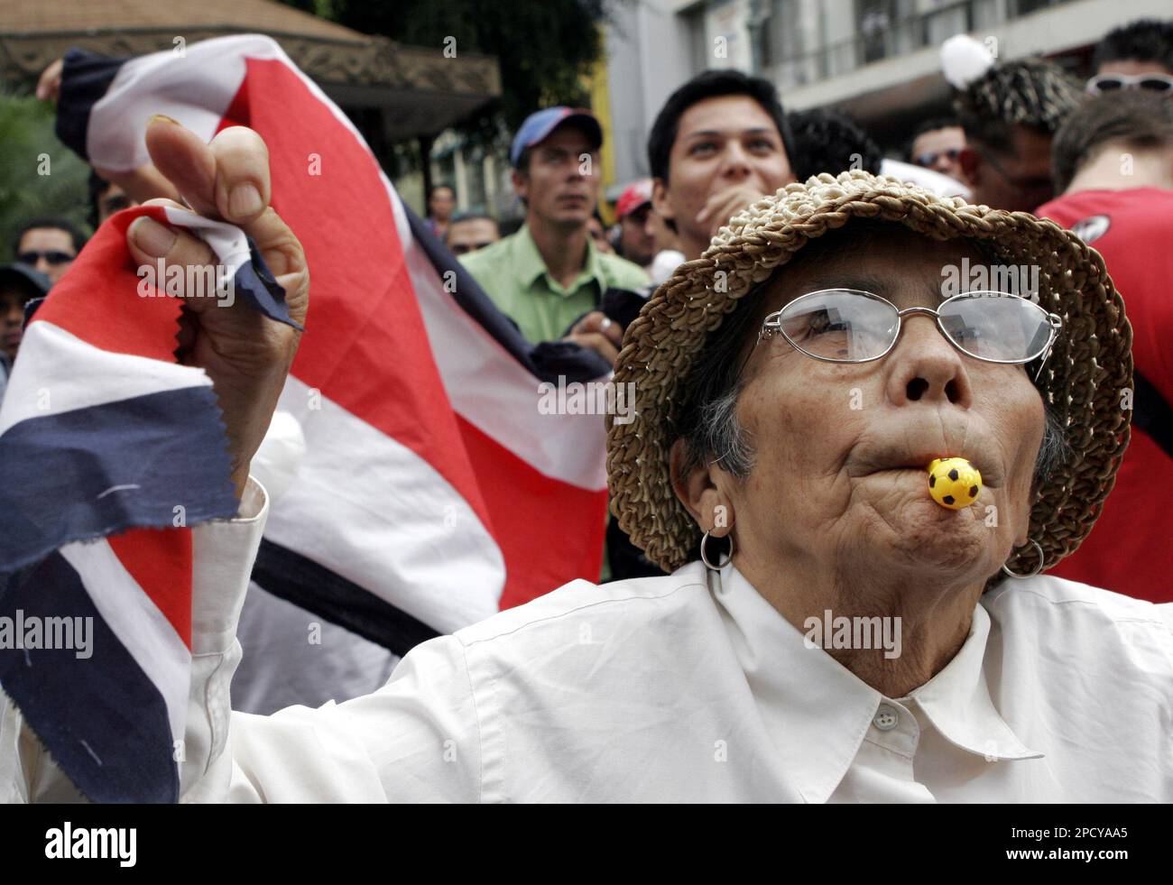 Costa Rican fan Teresa Arguerro cheers Costa Rica during their game