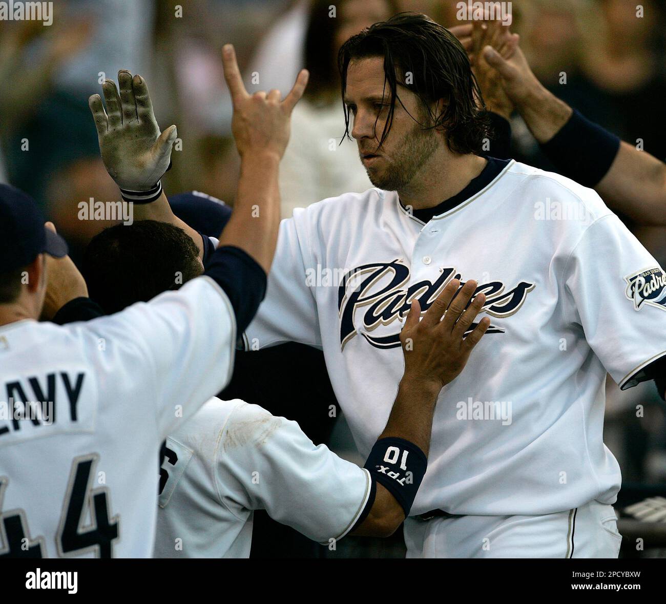 San Diego Padres' Mark Bellhorn is greeted at the dugout after his