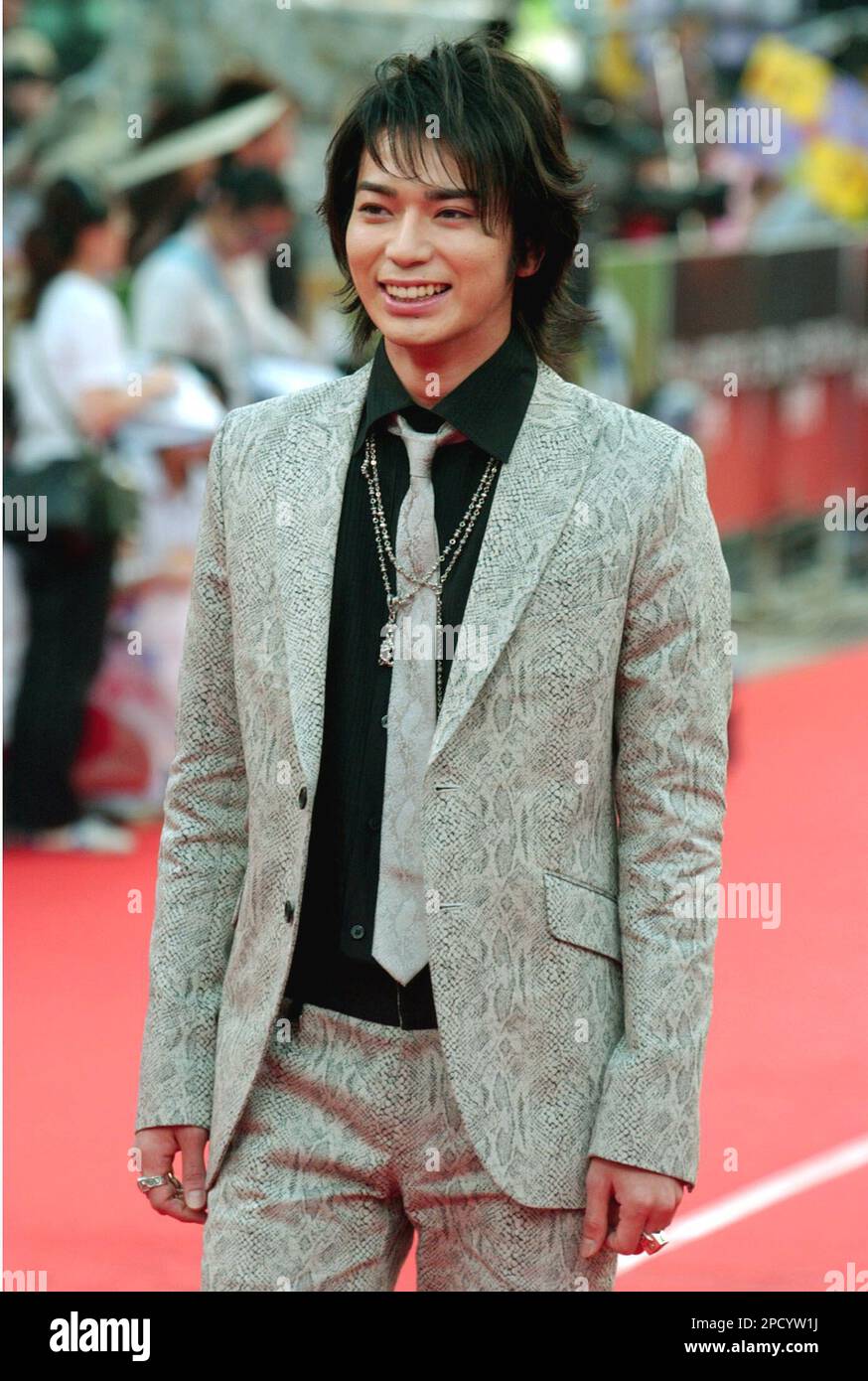 Japanese singer Jun Matsumoto smiles as he arrives at the 17th Golden Melody Awards, Saturday, June 10, 2006, in Taipei, Taiwan. Matsumoto is a guest at this year's Golden Melody Awards_one of the Chinese-language music industry's biggest annual events. (AP Photo/Chiang Ying-ying) Stock Photo