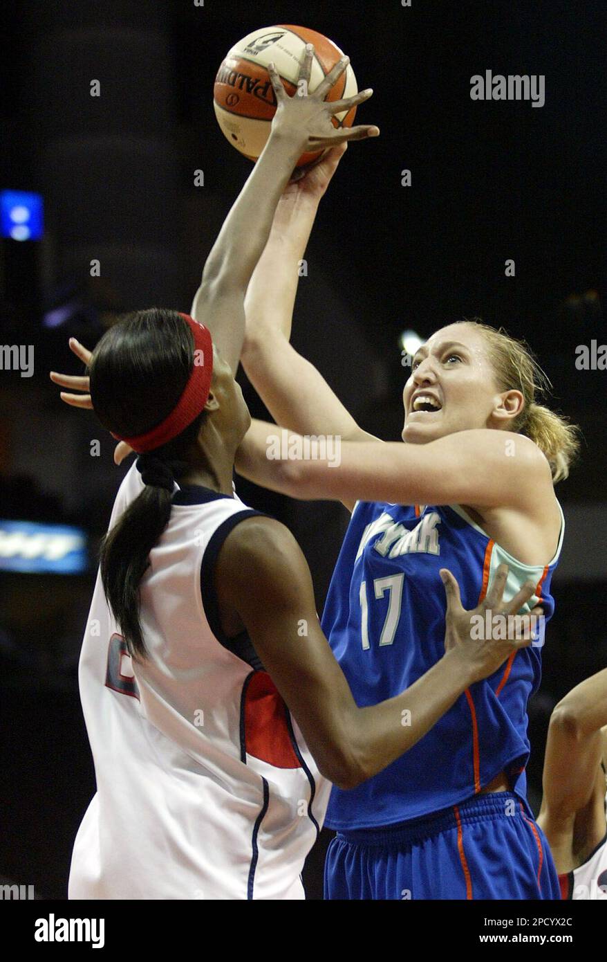 New York Liberty's Kelly Schumacher, right, takes a shot against