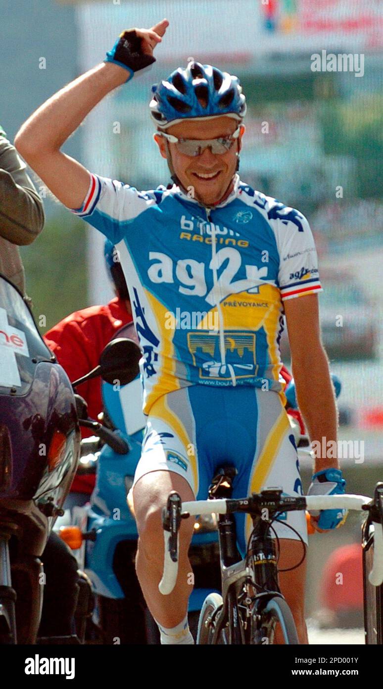 Ludovic Turpin of France celebrates as he crosses the finish line to