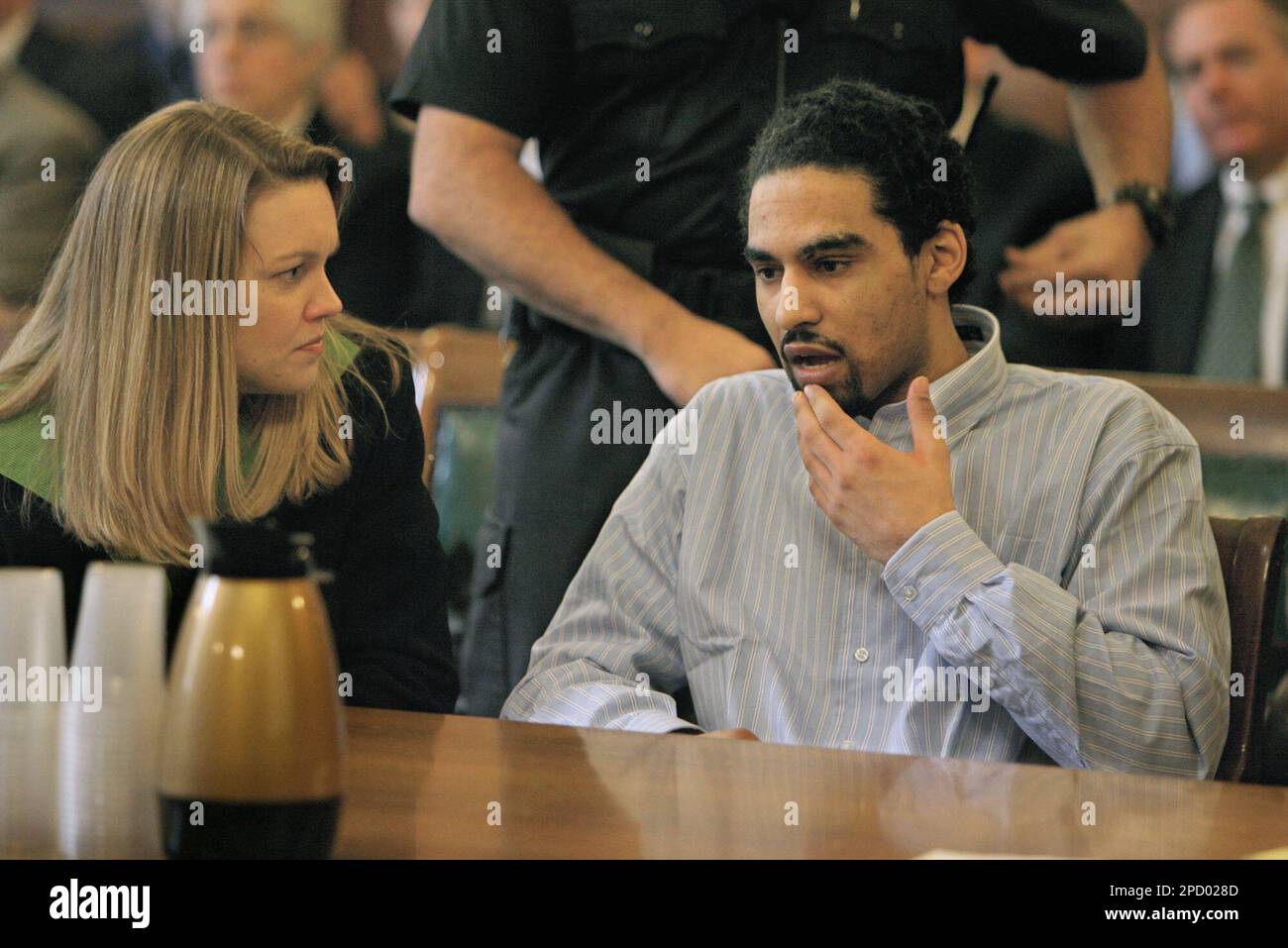 Esteban Carpio, right, talks with his attorney Kirsten M. Wenge during