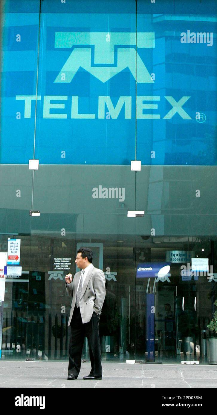 A man stands in front of the offices of Mexican telecommunications giant  Telmex in Mexico City, Mexico, Wednesday, May 31, 2006. Mexico's July 2  elections will likely open the nation further to