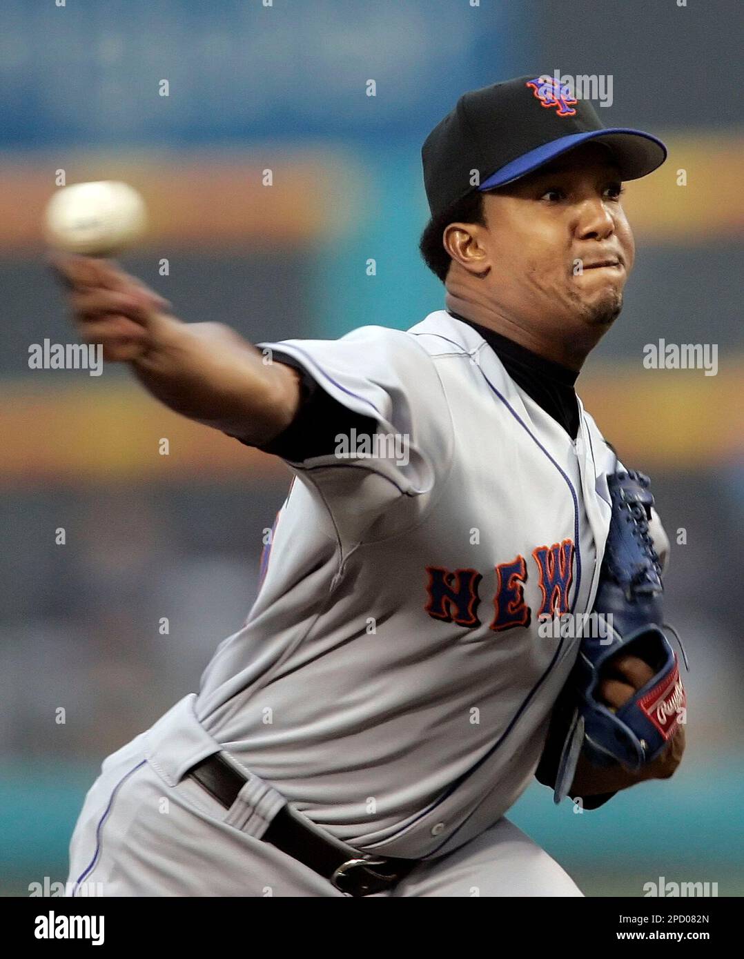 New York Mets pitcher Pedro Martinez puts his hand to his face after he was  taken out of the baseball game in the sixth inning against the Los Angeles  Dodgers in Los