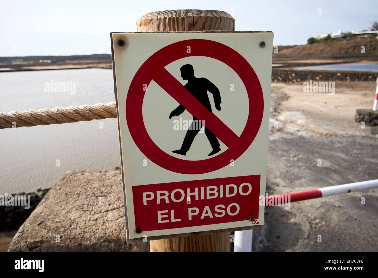 prohibido el paso no entry sign at salinas de janubio salt flats Lanzarote, Canary Islands, Spain Previously tourists would just wander around the sit Stock Photo
