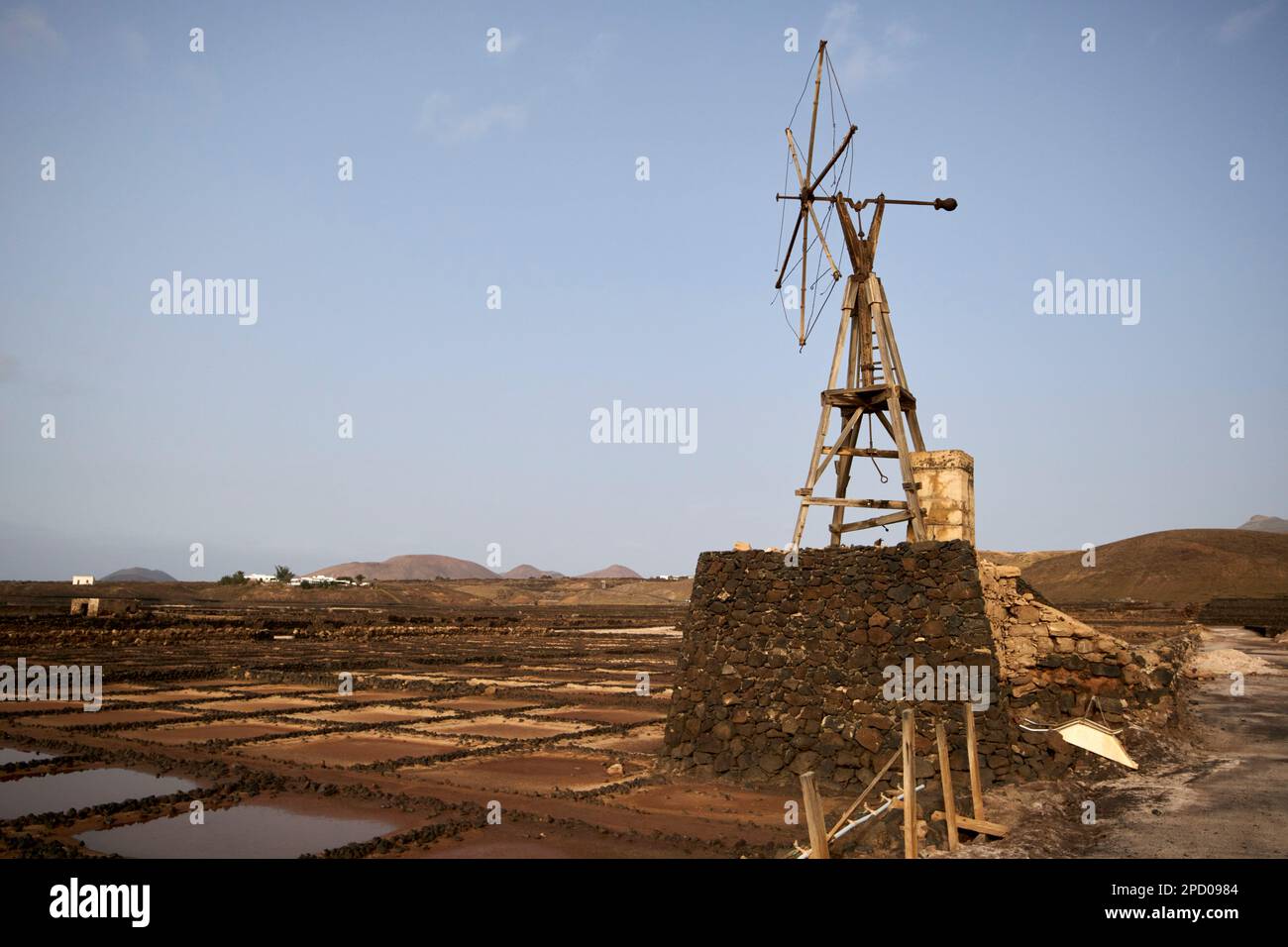 final stage salt water evaporation pools with remains of old wind