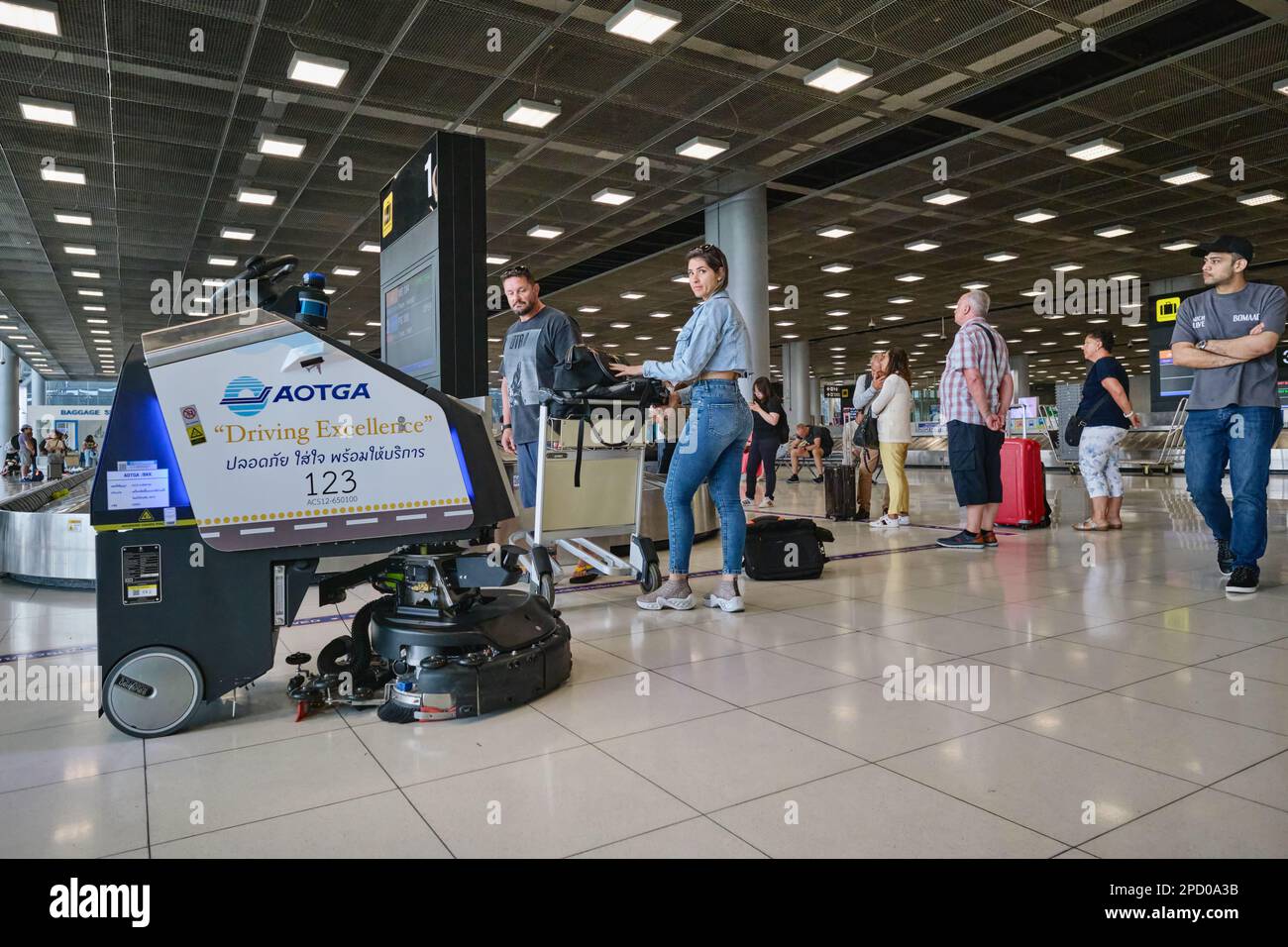 Skillfully avoiding passengers, a cleaning robot cleans the luggage