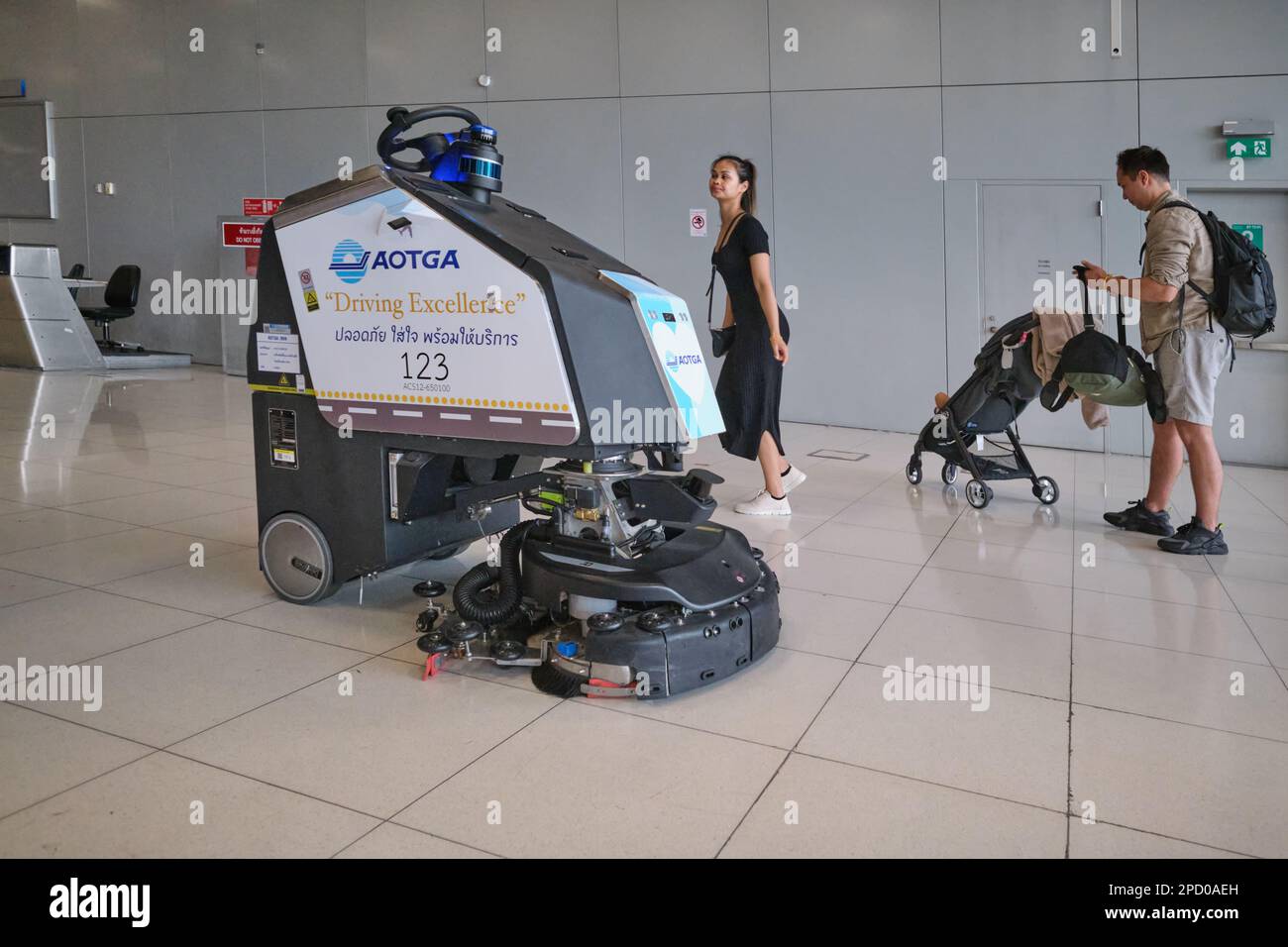 A cleaning robot cleans the luggage retrieval area in the domestic
