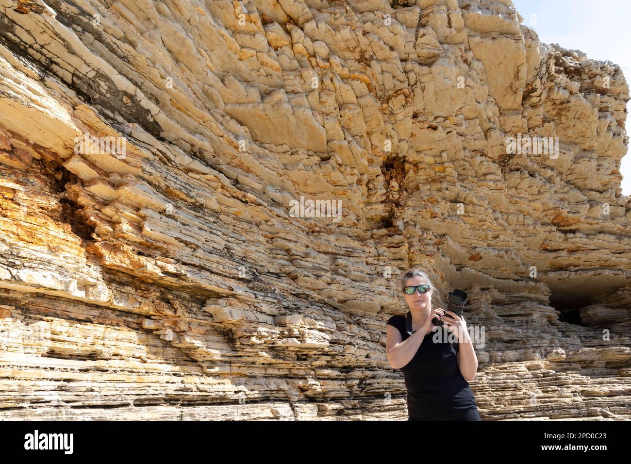 woman woman photographed on the rocks of Cape Kamenjak, a protected natural area on the southern tip of the Istrian peninsula in Croatia, Europe Stock Photo