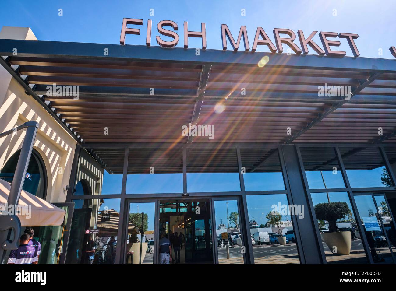 The front entrance, facade and sign of the new building. At the fish