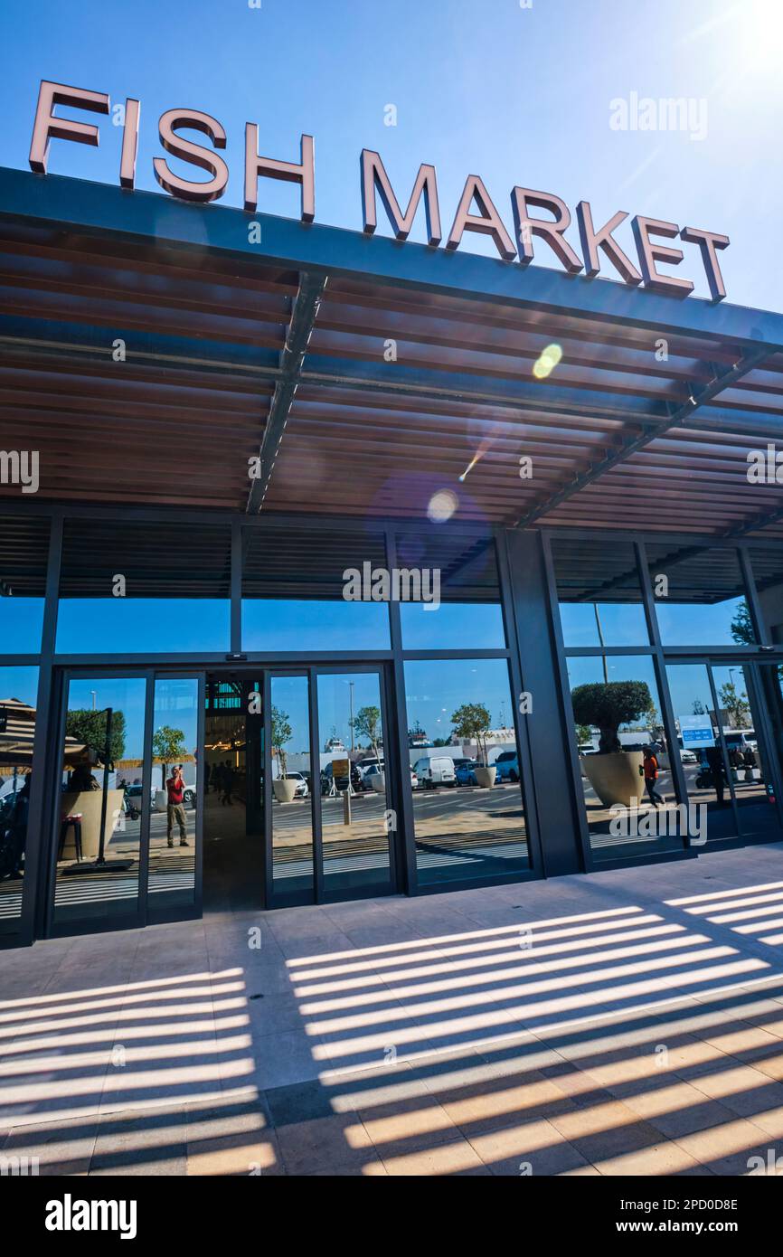 The front entrance, facade and sign of the new building. At the fish