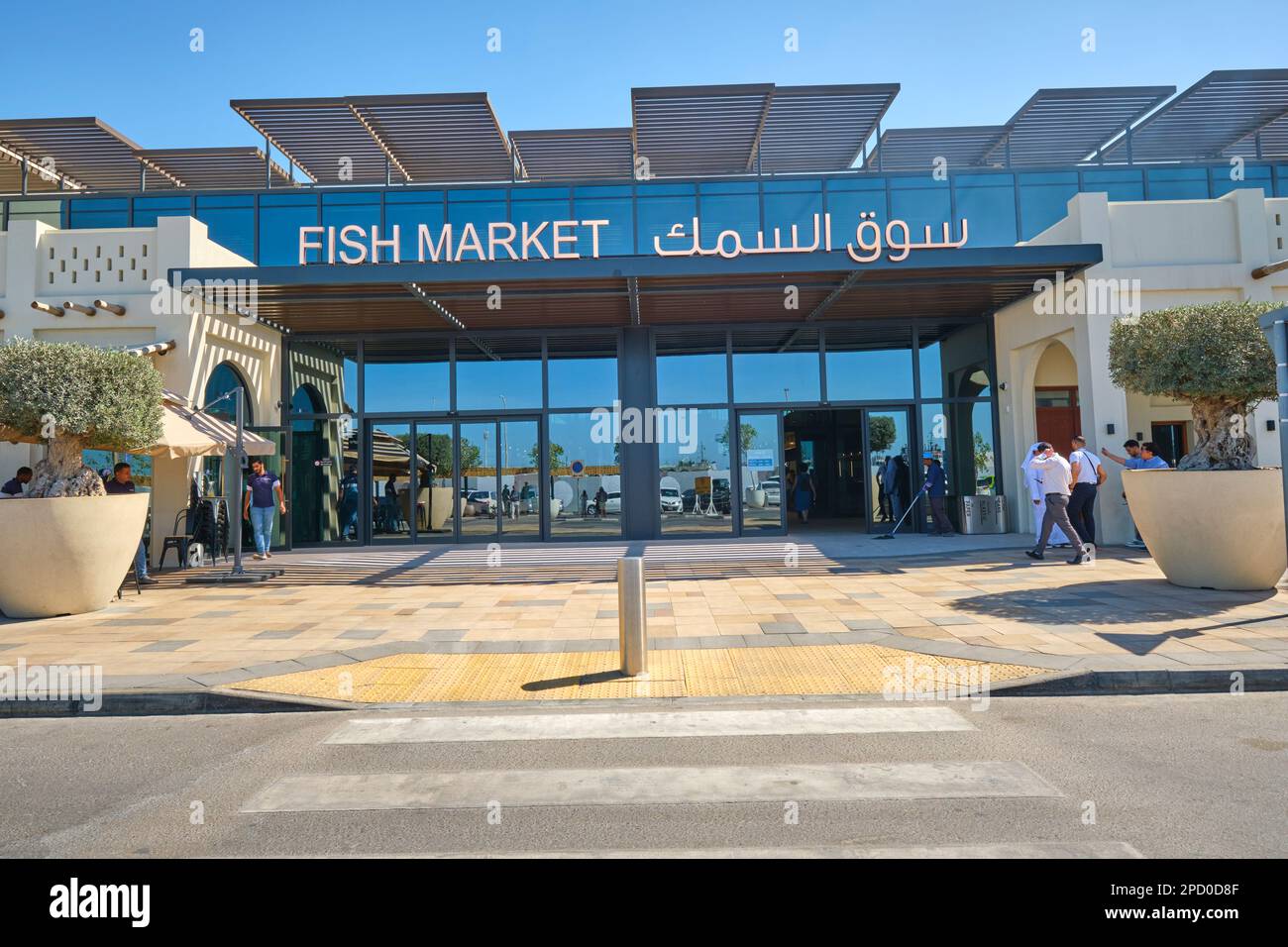 The front entrance, facade and sign of the new building. At the fish