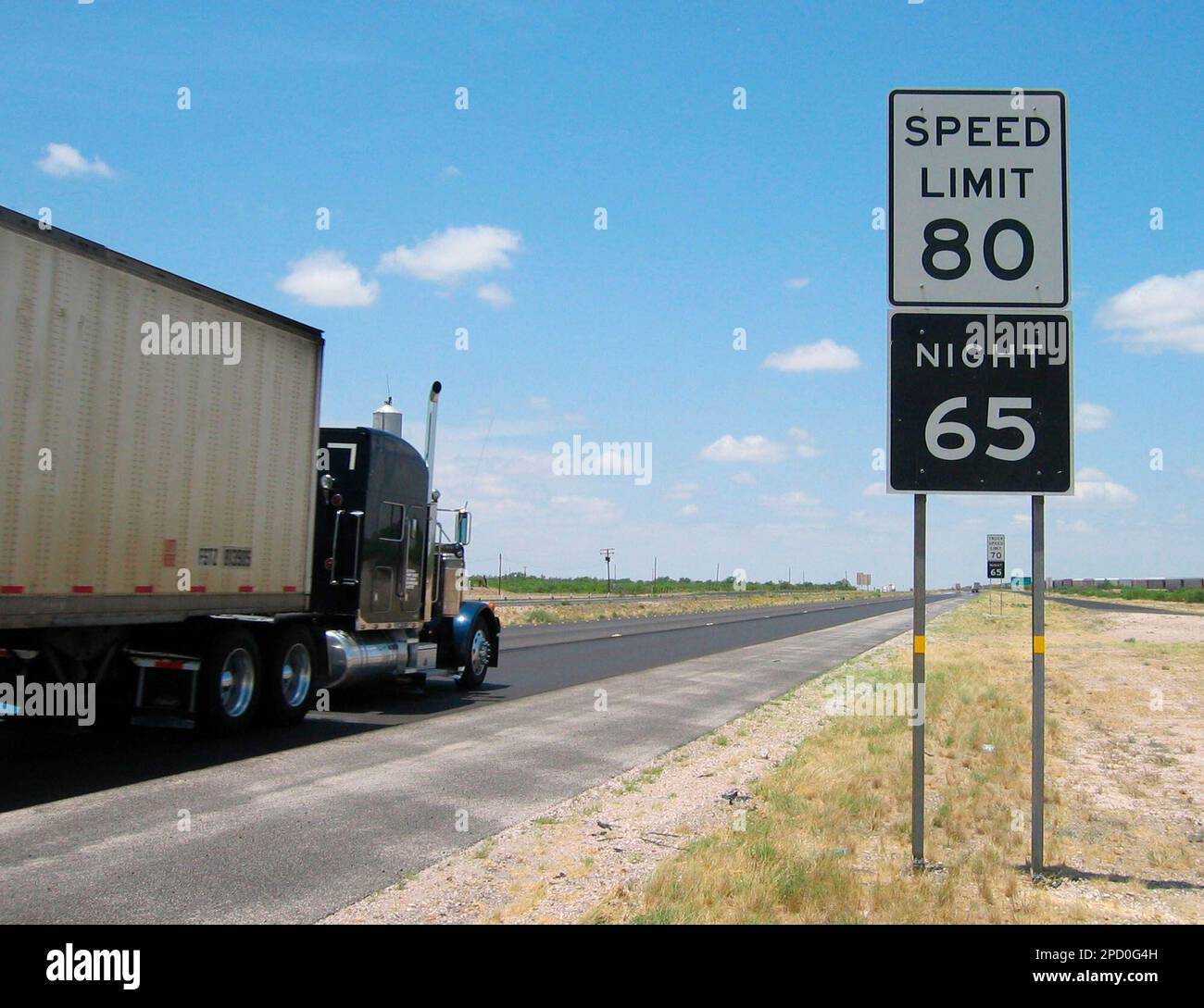 A truck barrels past a newly posted 80 mph speed limit sign just west ...