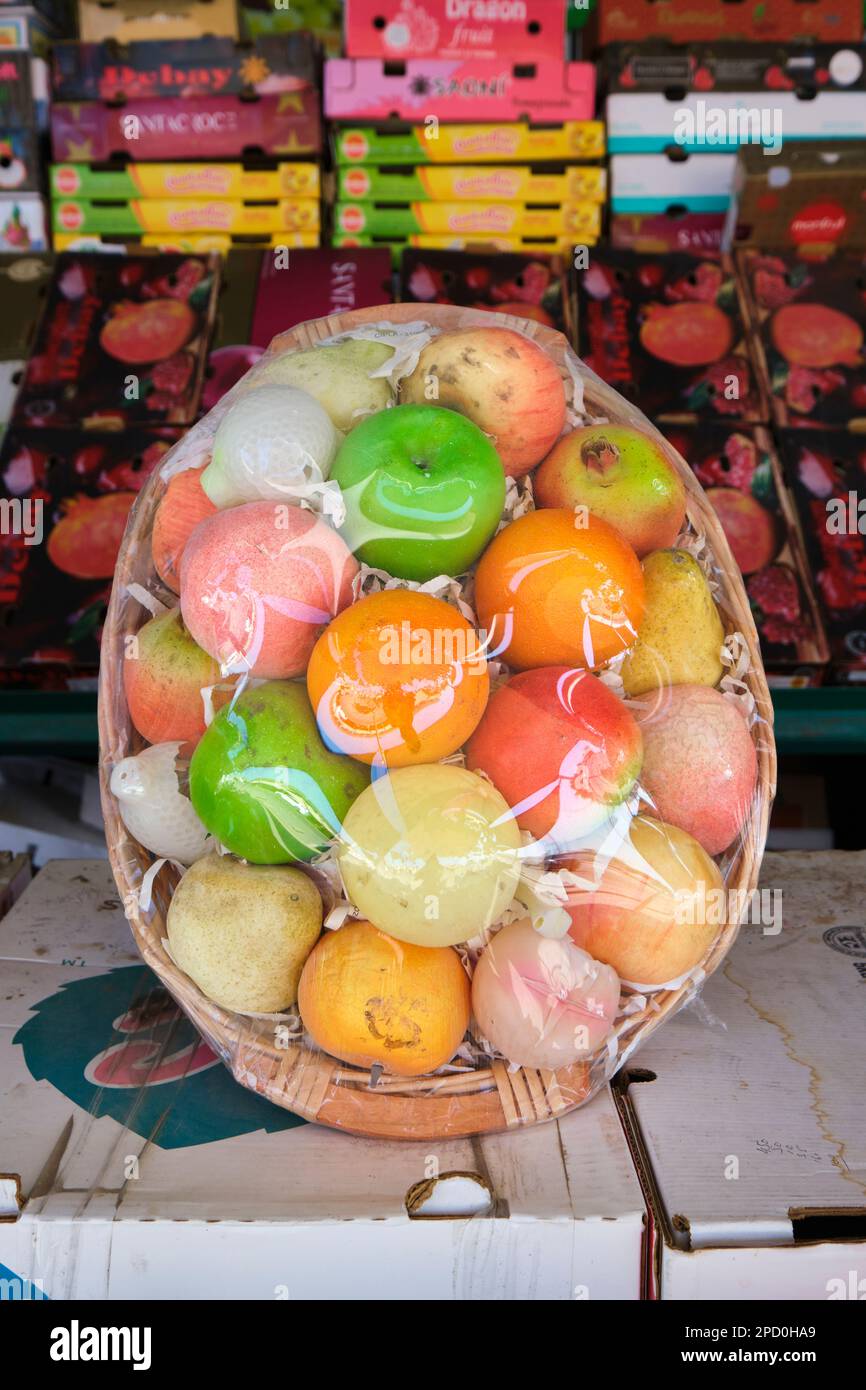 A sample fruit basket, made of fake, plastic pieces. At the local fruit