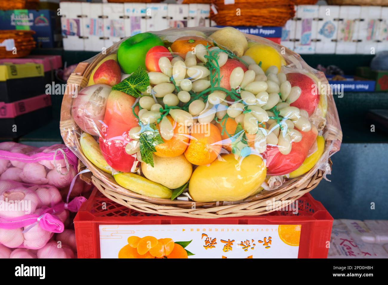 A sample fruit basket, made of fake, plastic pieces. At the local fruit