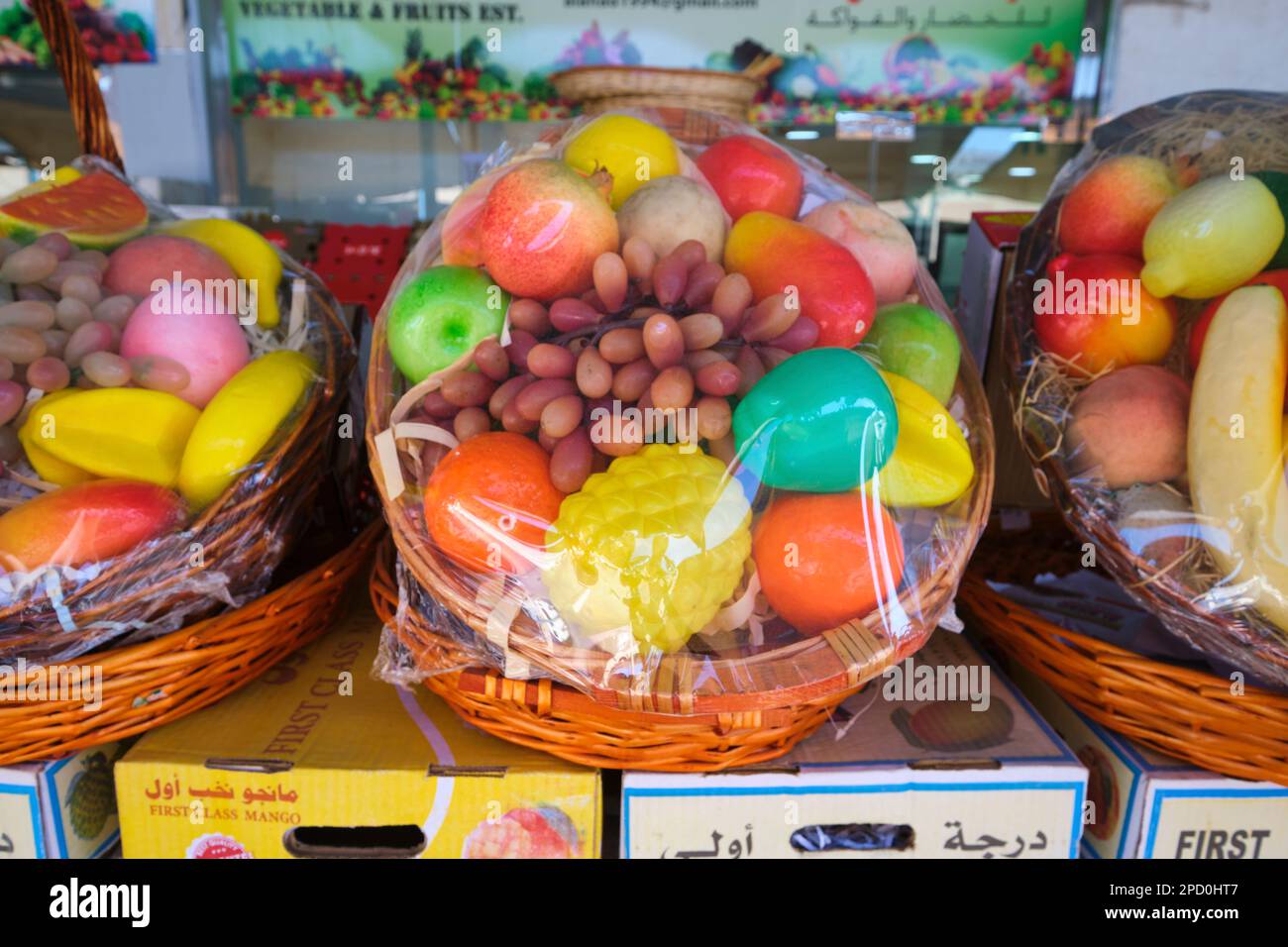 A sample fruit basket, made of fake, plastic pieces. At the local fruit