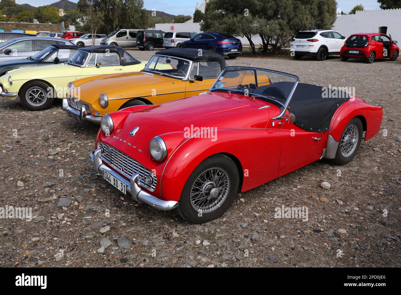 CADAQUES, SPAIN - OCTOBER 5, 2021: Triumph TR2 red roadster sports car parked in Spain. Stock Photo