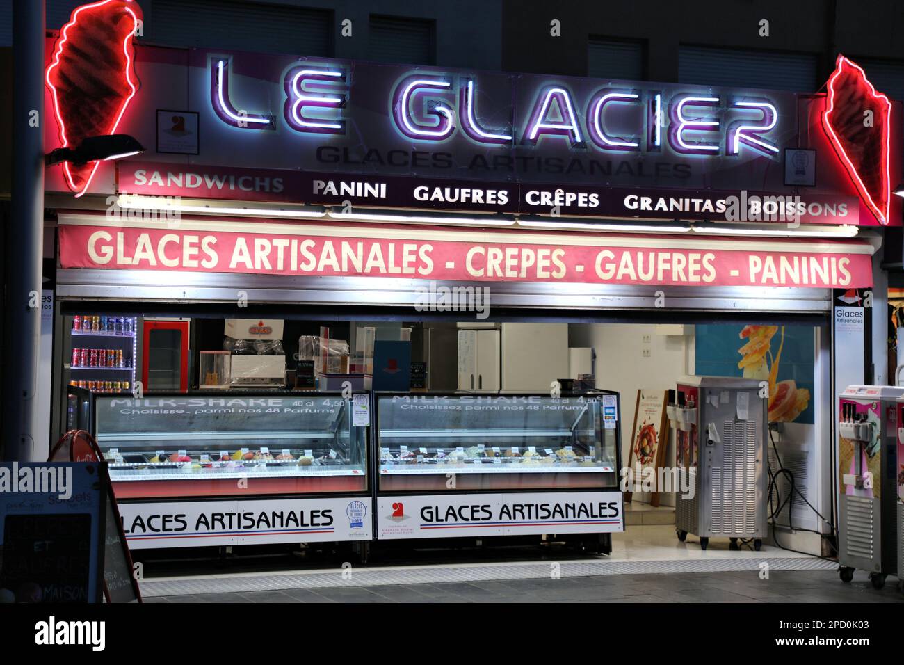 CAP D'AGDE, FRANCE - OCTOBER 2, 2021: Evening street view of a local ice cream parlor of Cap d'Agde resort in Occitanie region of France. Stock Photo