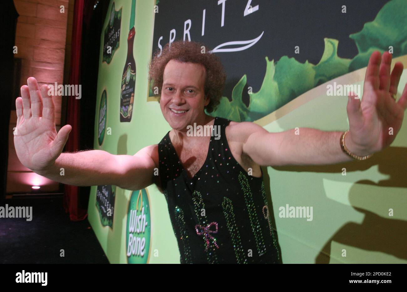 Richard Simmons poses for a photograph after hosting a summer salad