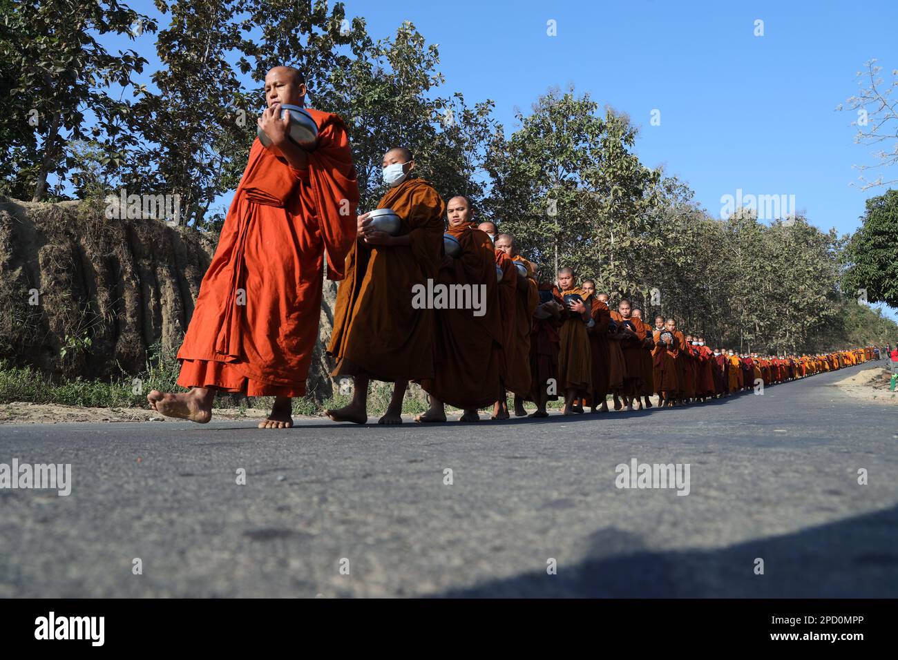 Theravada Buddhism: Monks lined up, Khagrachari, Bangladesh. Stock Photo