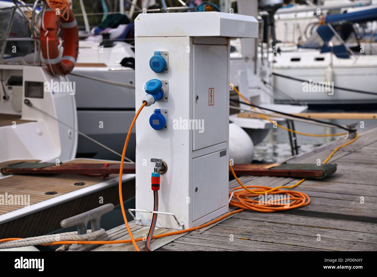 Electrical power box pedestal in Pakleni Islands harbor, Croatia Stock