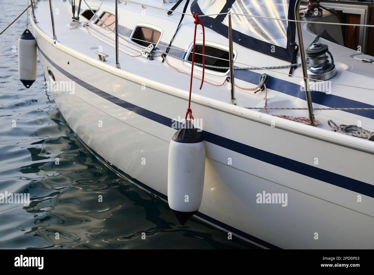 Sailing in Dubrovnik, Croatia. Sailing yacht fenders on port side. Inflatable fender buoys. Stock Photo