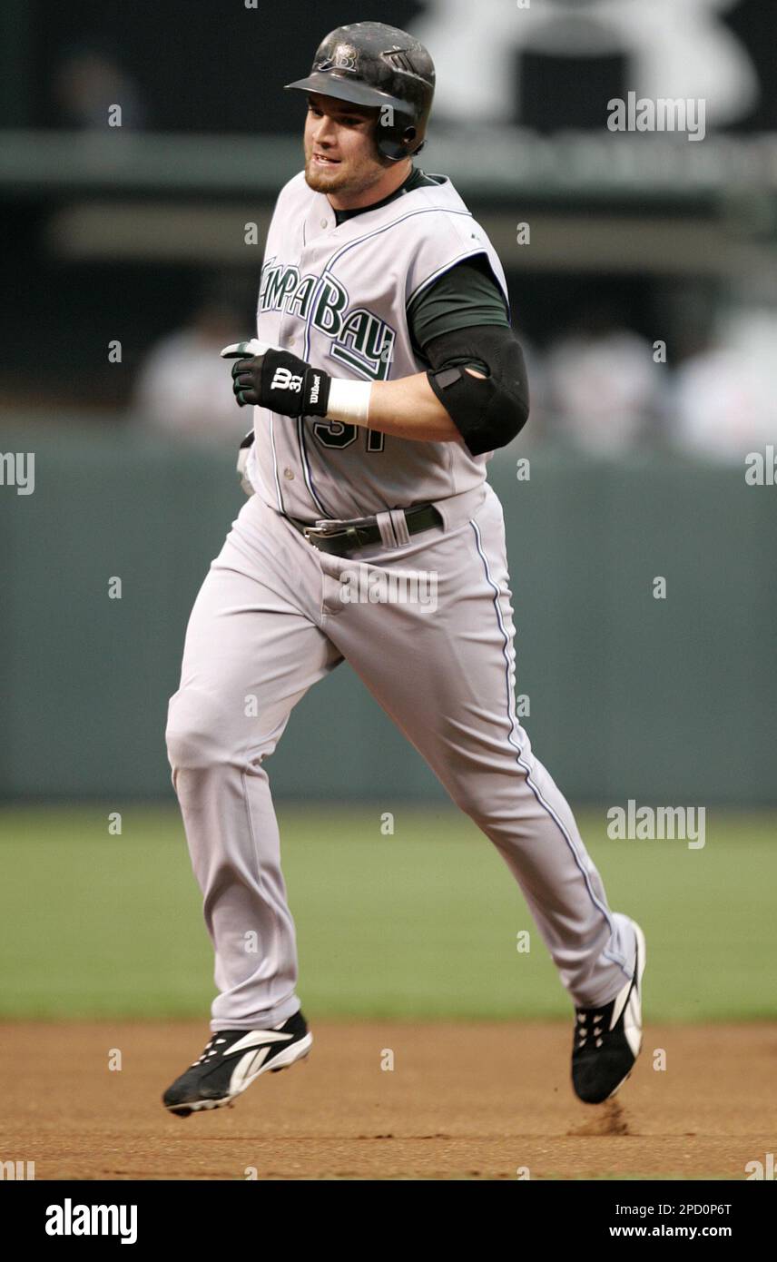 Tampa Bay Devil Rays' Jonny Gomes rounds the bases after hitting a two-run  home run during the first inning of a baseball game against the Baltimore  Orioles on Thursday, June 1, 2006,