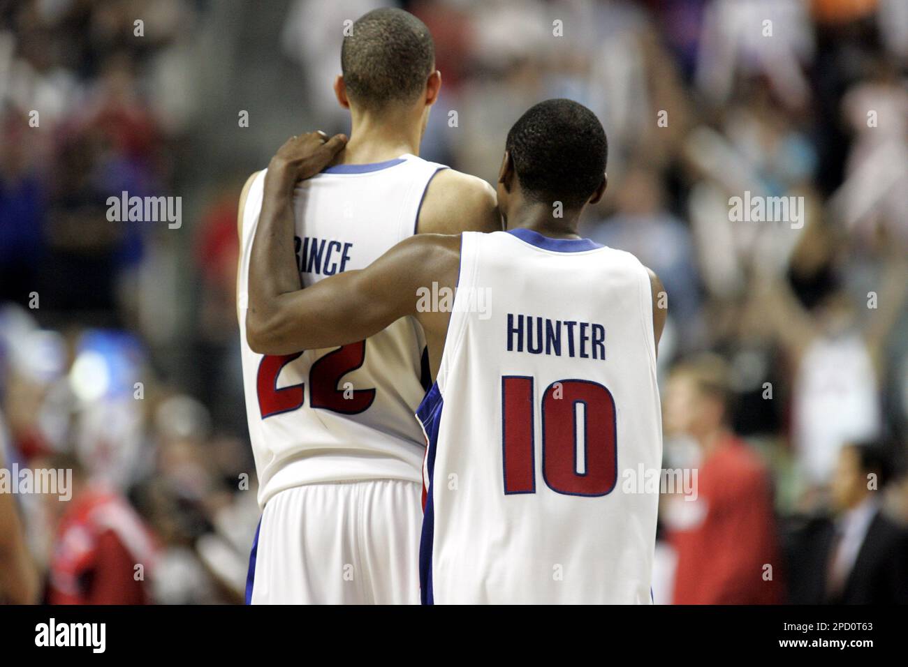 Detroit Pistons guard Lindsey Hunter (10) puts his arm around forward Tayshaun  Prince (22) in the closing seconds of Game 5 of the Eastern Conference  basketball finals against the Miami Heat at