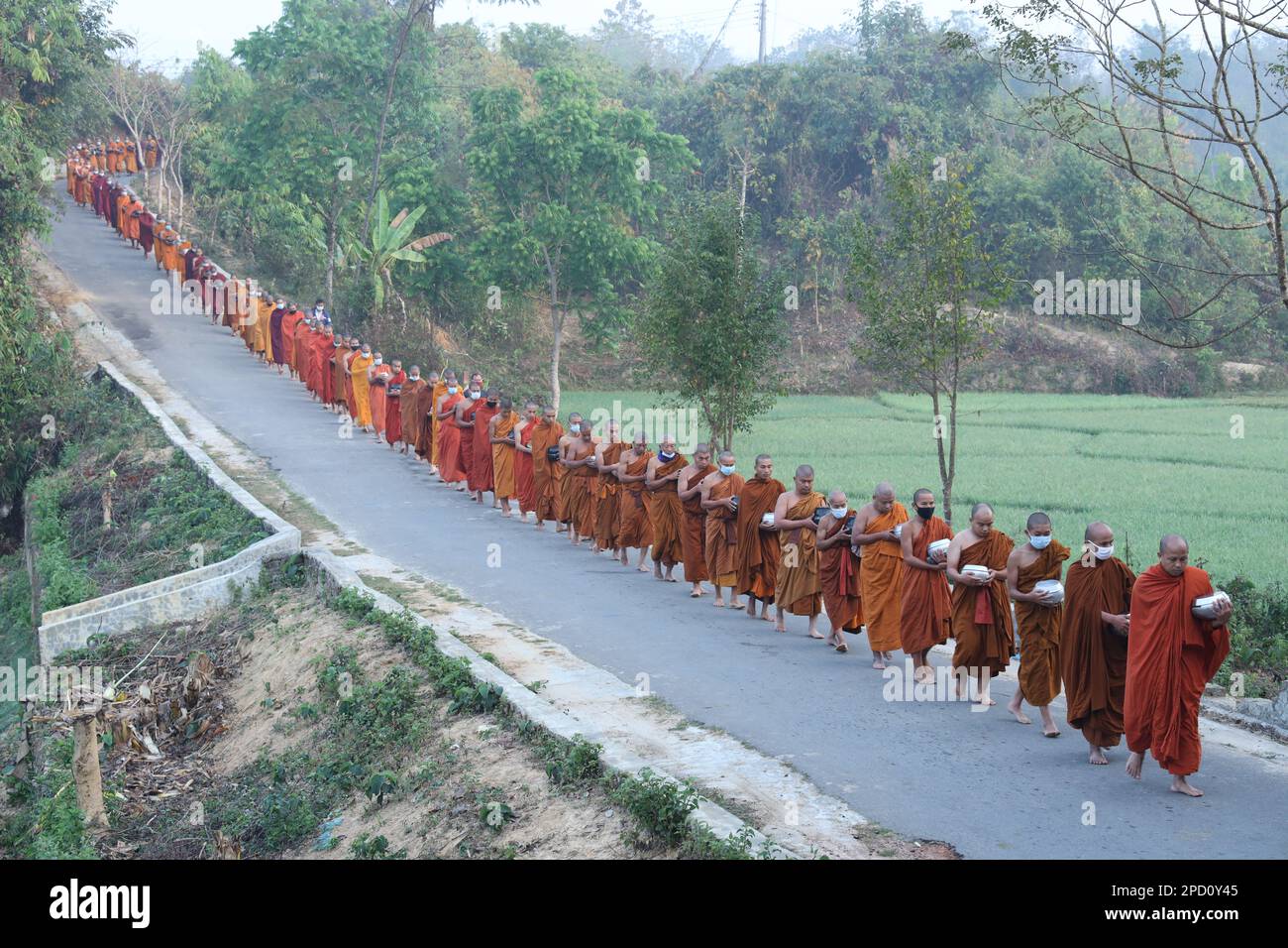 Theravada Buddhism: They are going in the early morning, Khagrachari, Bangladesh. Stock Photo