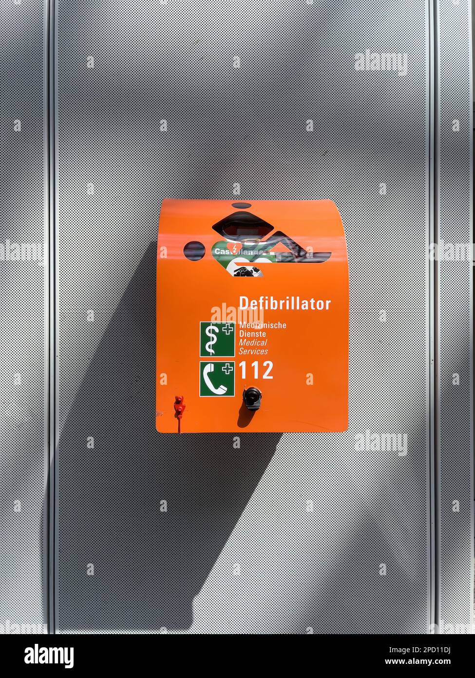 Defibrillator Inside A Modern Airport With Text In Multiple Languages defibrillator-inside-a-modern-airport-with-text-in-multiple-languages